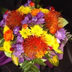 Box arrangement including leucospermum 'Pins' and other sesonal flowers