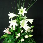 ceramic pot with lilies and other flowers