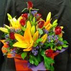Lilies and Roses in a Box of flowers