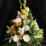 Roses & Carnations with other seasonal flowers in a Pot