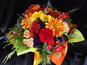 Posy of flowers in a coloured box