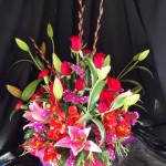 Roses and lilies in a box arrangement